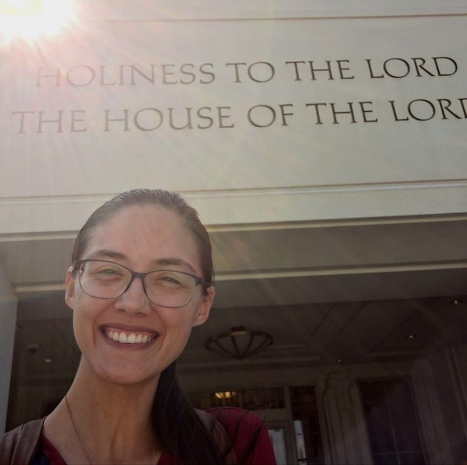 Rachel smiling beneath the carved inscription "Holiness to the Lord, The House of the Lord"